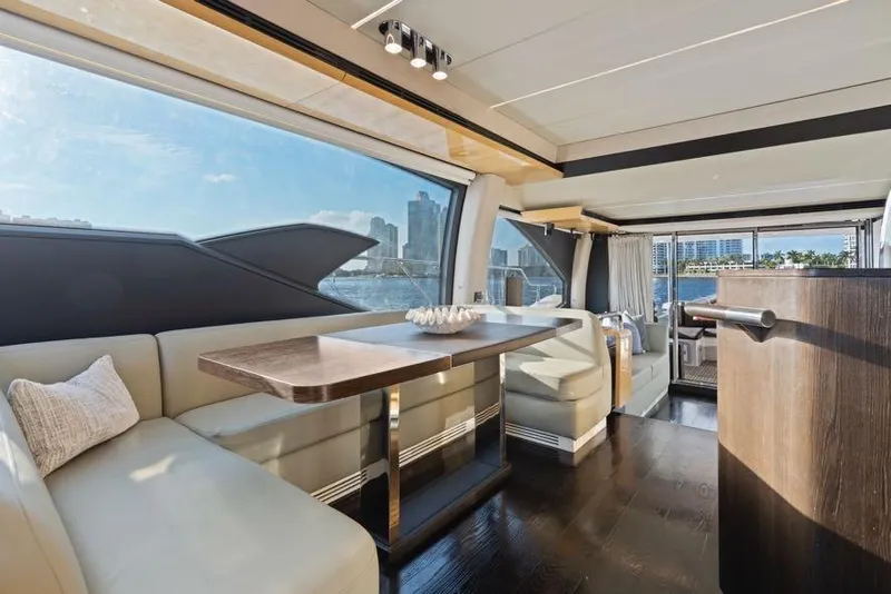 Slide: The Image of Luxurious interior of 2017 Azimut 66 yacht with elegant seating and panoramic windows. - 18