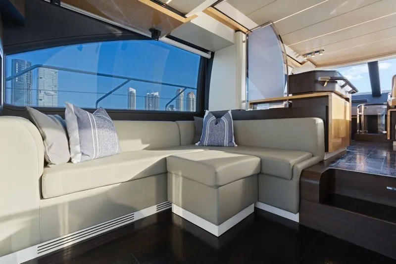 Slide: The Image of Luxurious interior of 2017 Azimut 66 yacht with elegant seating and cityscape view. - 20