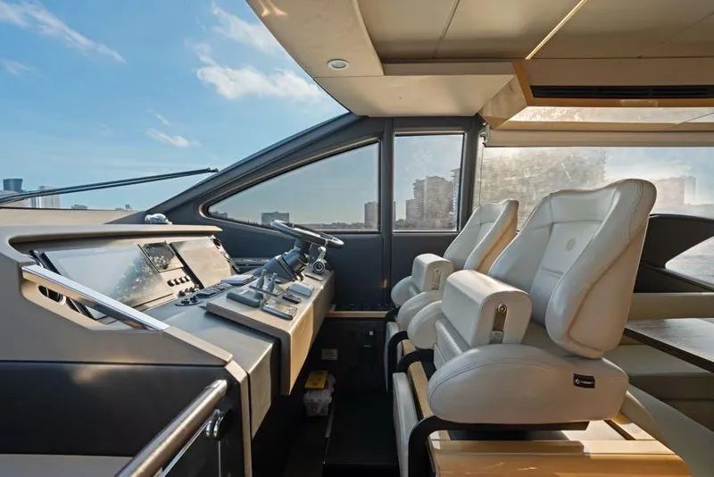 Slide: The Image of Luxurious interior of a 2017 Azimut 66 yacht with modern helm and seating. - 23