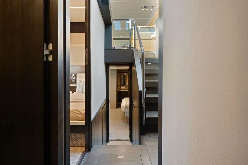 Slide: The Image of Interior hallway of a 2017 Azimut 66 yacht, featuring modern design and elegant finishes. - 24