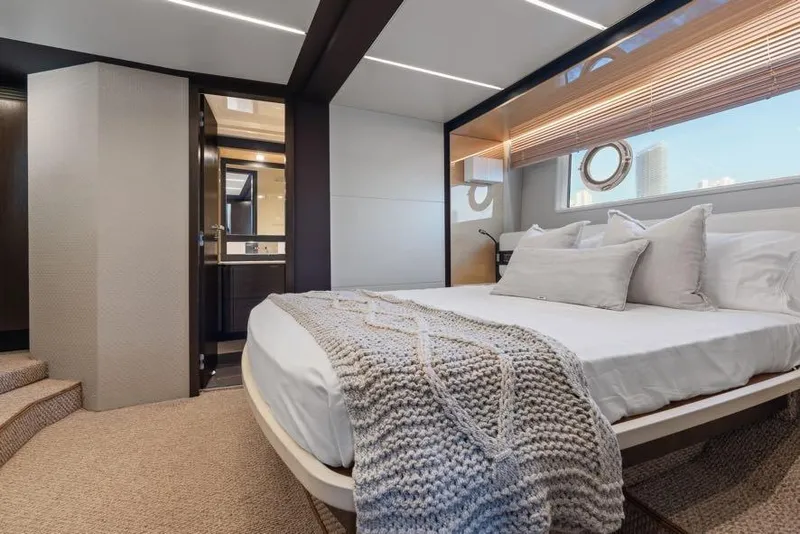 Slide: The Image of Luxurious bedroom interior of 2017 Azimut 66 yacht with modern decor and large window. - 25