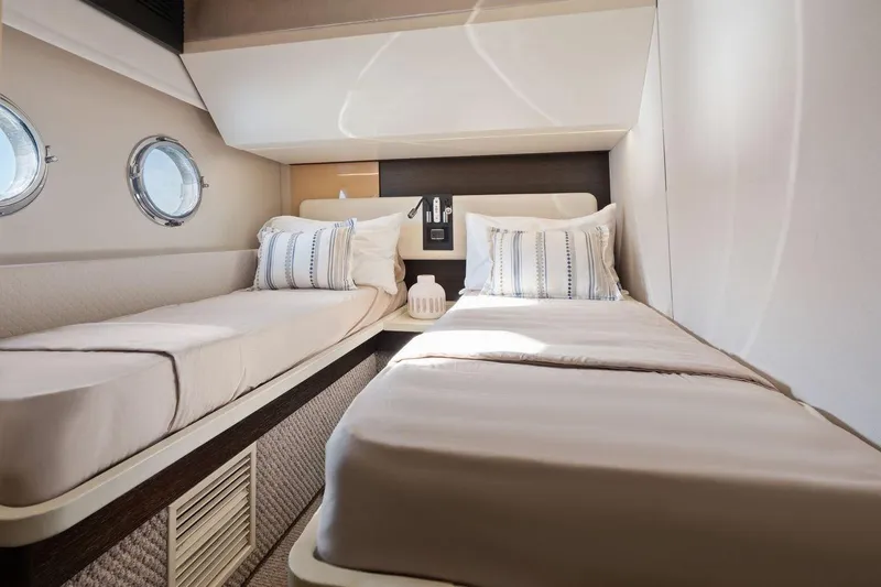 Slide: The Image of Luxurious twin cabin interior of 2017 Azimut 66 yacht with porthole windows. - 33
