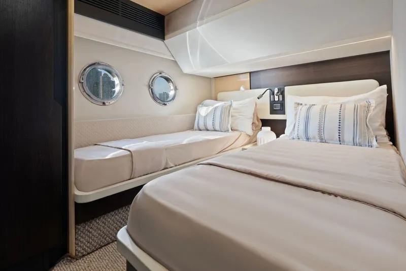Slide: The Image of Luxurious twin cabin interior of 2017 Azimut 66 yacht with porthole windows. - 34
