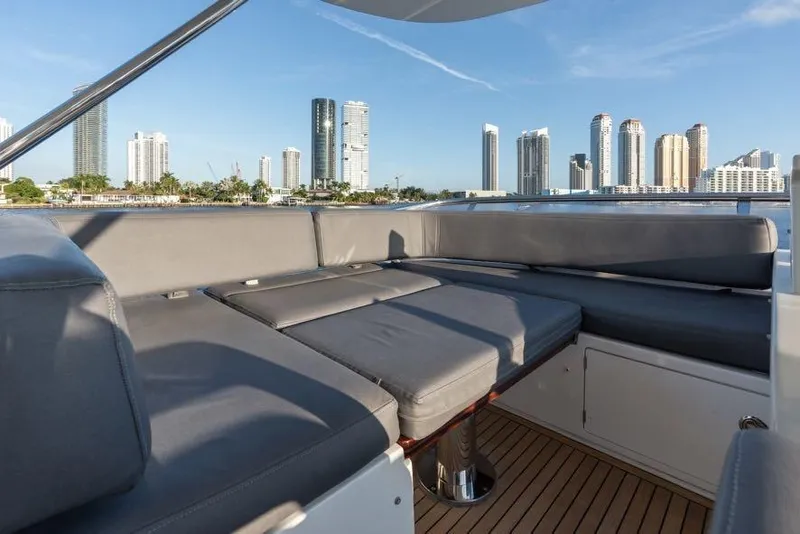Slide: The Image of Luxurious seating on 2017 Azimut 66 yacht with city skyline backdrop. - 9