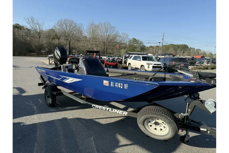Slide: The Image of 2020 Crestliner 1700 boat on trailer in parking lot, sunny day. - 10