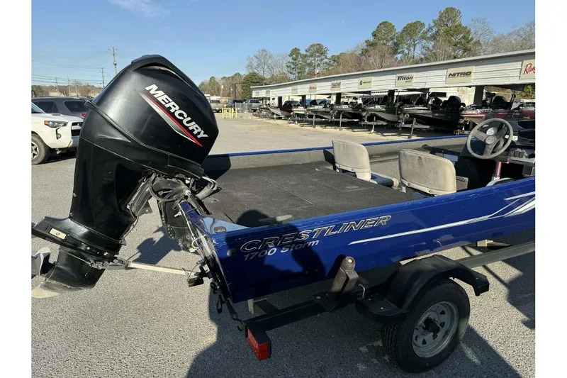 Slide: The Image of 2020 Crestliner 1700 boat with Mercury outboard motor in a dealership lot. - 7