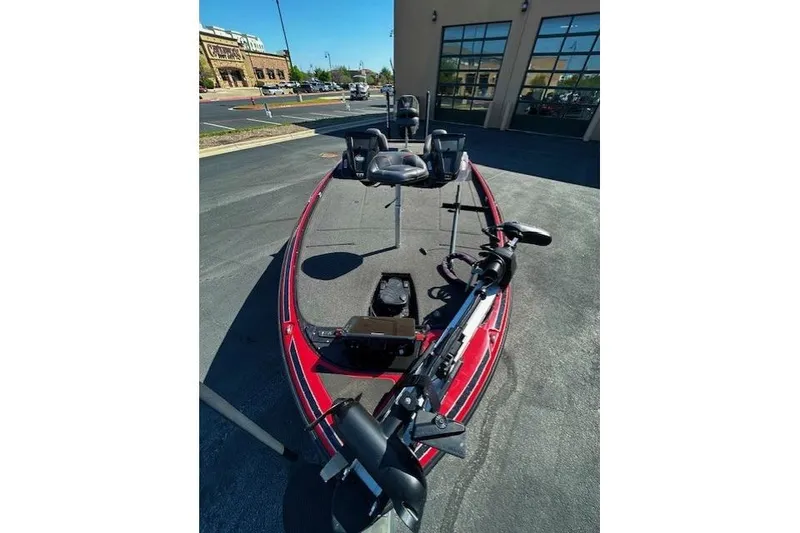 Slide: The Image of 2019 Nitro Z21 Elite bass boat parked outside a building on a sunny day. - 4