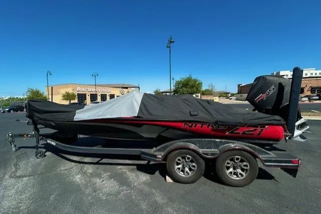 Slide: The Image of 2019 Nitro Z21 Elite boat on trailer, covered, parked in a lot. - 6