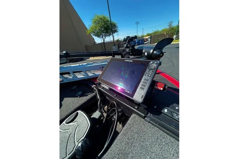 Slide: The Image of 2019 Nitro Z21 Elite boat with Lowrance fishfinder and trolling motor in sunny outdoor setting. - 7