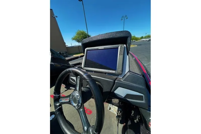 Slide: The Image of 2019 Nitro Z21 Elite boat dashboard with steering wheel and electronic display. - 8