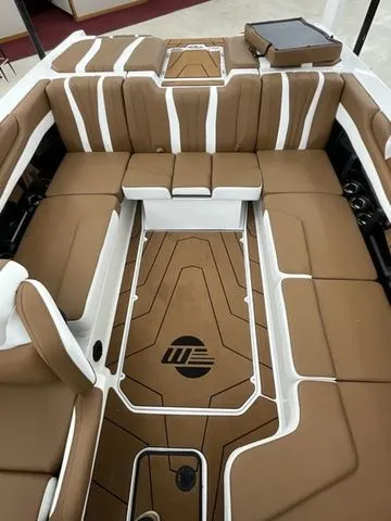 Slide: The Image of Interior of 2026 Malibu Wakesetter 22 LSV with brown upholstery. - 10