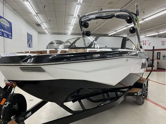 Slide: The Image of 2026 Malibu Wakesetter 22 LSV boat in showroom. - 3