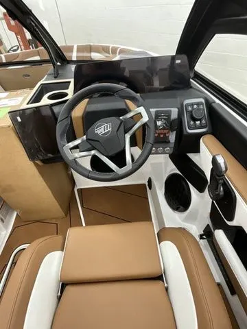 Slide: The Image of Interior of 2026 Malibu Wakesetter 22 LSV with modern steering wheel. - 9