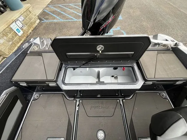 Slide: The Image of Interior view of the 2026 Lund 202 PRO-V GL Sport boat. - 13
