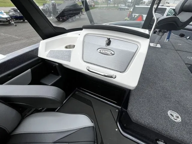Slide: The Image of Interior view of the 2026 Lund 202 PRO-V GL Sport boat. - 17