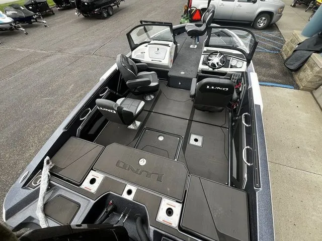 Slide: The Image of Interior view of the 2026 Lund 202 PRO-V GL Sport boat. - 9