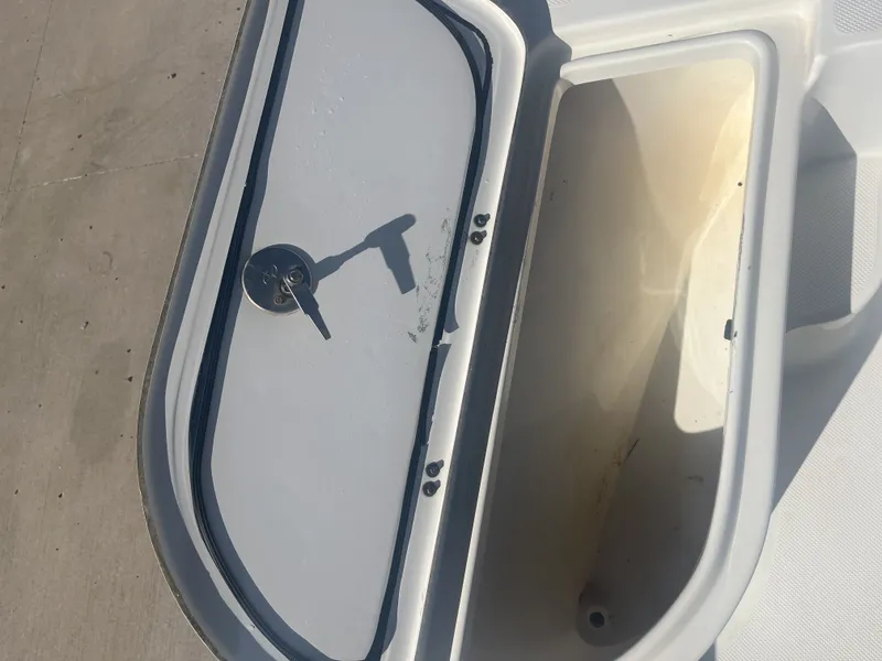 Slide: The Image of Open storage compartment on a 2013 Sea Fox 180XT boat. - 14