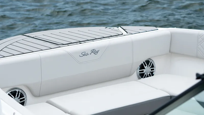 Slide: The Image of 2026 Sea Ray SDX 270 Outboard, luxurious white seating by the water. - 14