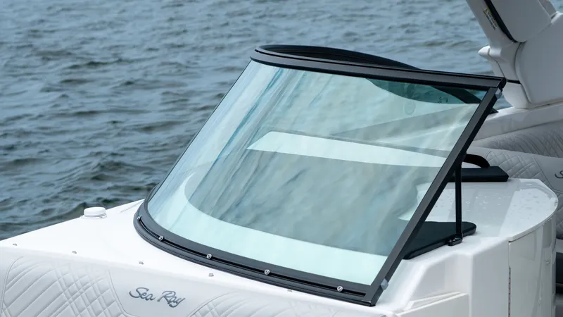 Slide: The Image of 2026 Sea Ray SDX 270 Outboard boat on calm water. - 15