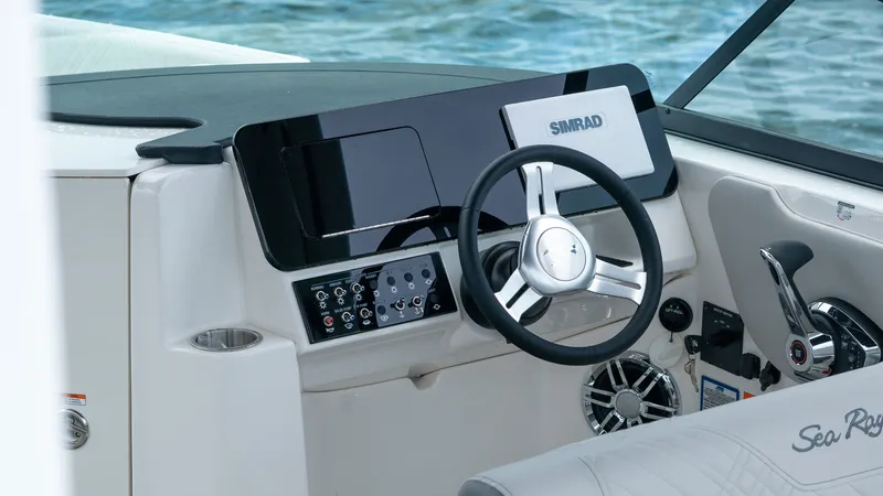 Slide: The Image of Sea Ray SDX 270 Outboard 2026 helm with Simrad display. - 21