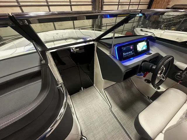 Slide: The Image of The image shows the cockpit of a Regal LS6 boat with modern instruments and sleek design. - 3