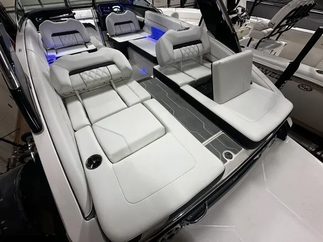 Slide: The Image of Interior of a modern boat with white upholstery and blue lighting. - 9