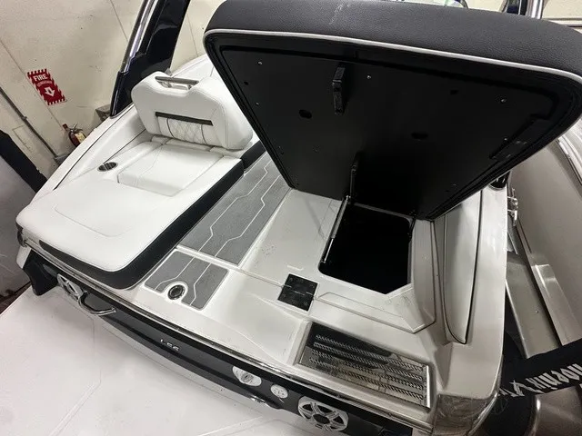 Slide: The Image of The image shows the rear of a Regal LS6 boat with an open storage compartment. - 4