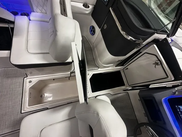 Slide: The Image of Interior of a modern boat with white seating and blue lighting. - 7