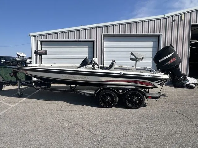 The Image of 2010 Phoenix 721 ProXP boat parked in front of garage. - 1