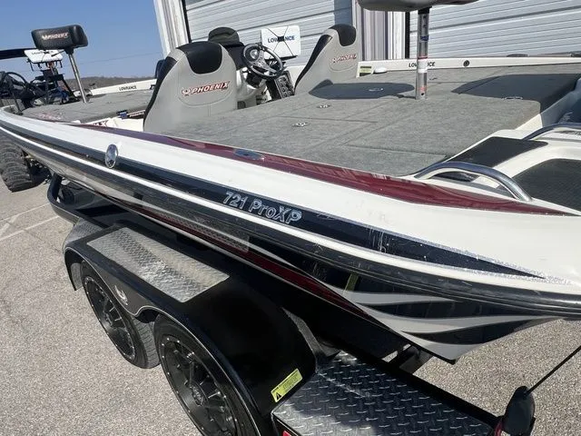 Slide: The Image of 2010 Phoenix 721 ProXP boat on trailer, side view. - 2