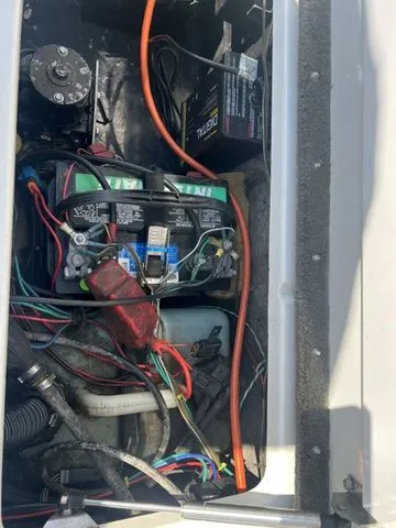 Slide: The Image of Interior view of a 2010 Phoenix 721 ProXP with battery and wiring. - 21