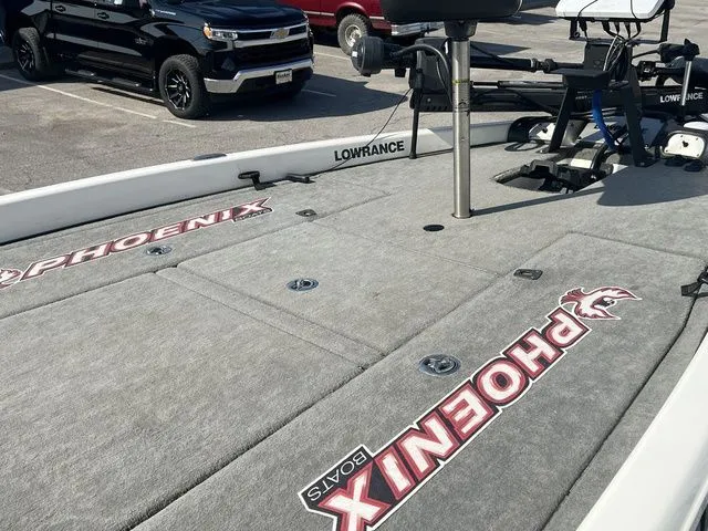 Slide: The Image of 2010 Phoenix 721 ProXP boat with Lowrance equipment on parking lot. - 26