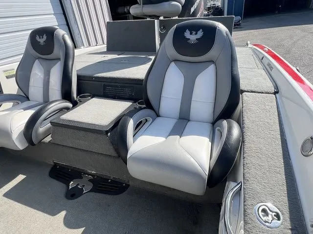 Slide: The Image of Interior of a 2010 Phoenix 721 ProXP boat with cushioned seats. - 30