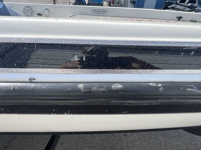 Slide: The Image of Close-up of a 2010 Phoenix 721 ProXP boat with scratches. - 8