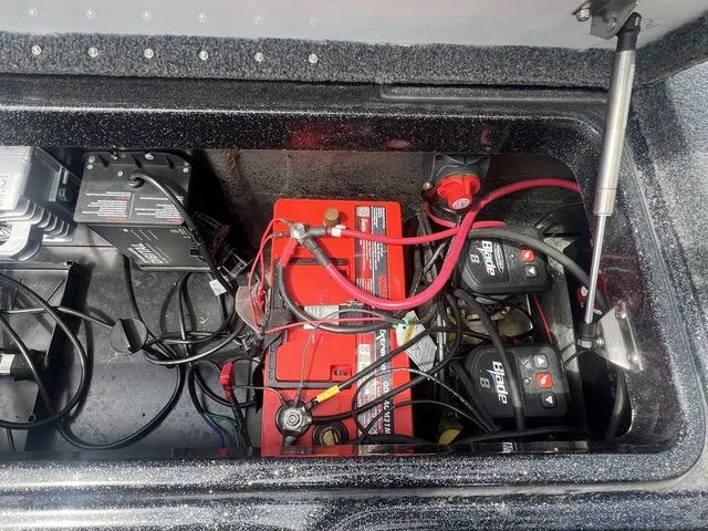 Slide: The Image of Battery compartment of 2023 Phoenix Bass Boats 921 Elite with wiring. - 16