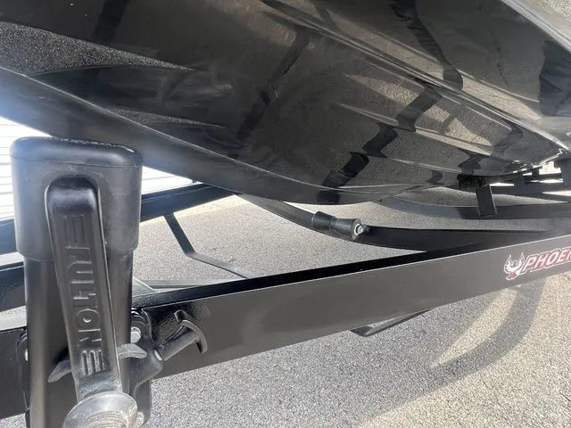Slide: The Image of Underside of a 2023 Phoenix Bass Boats 921 Elite on trailer. - 19