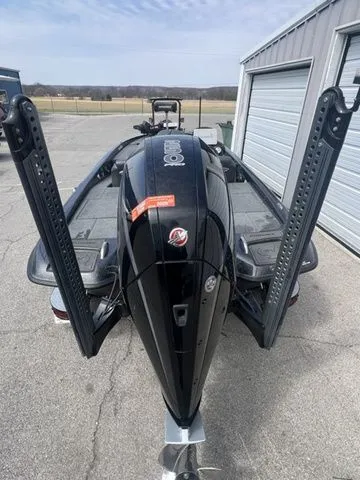 Slide: The Image of 2023 Phoenix Bass Boats 921 Elite in a parking area. - 3