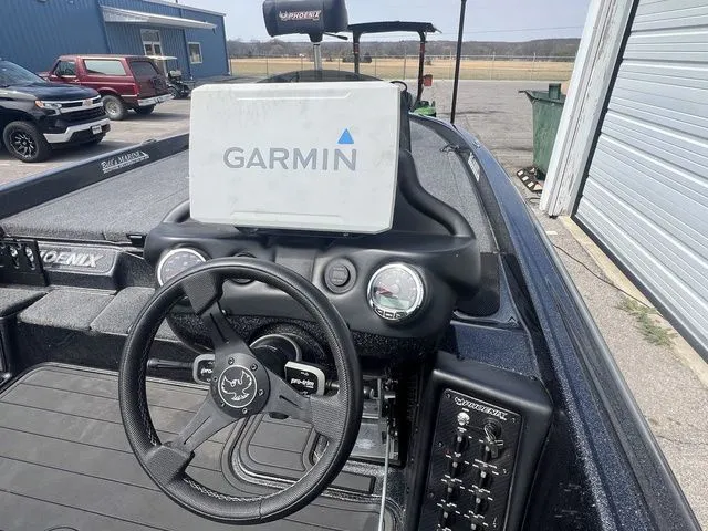 Slide: The Image of Interior of a 2023 Phoenix Bass Boats 921 Elite with Garmin device. - 6