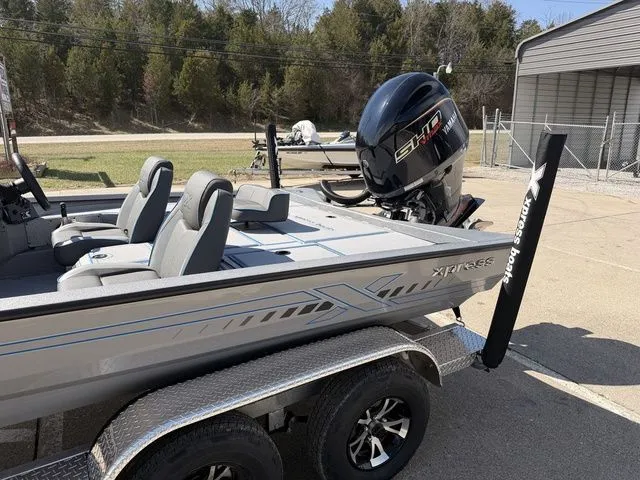 Slide: The Image of 2026 Xpress H20 boat on trailer with outboard motor. - 13