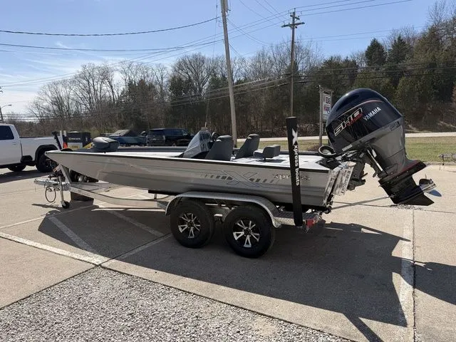 Slide: The Image of 2026 Xpress H20 boat with Yamaha outboard motor on trailer. - 14