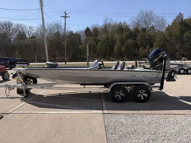 Slide: The Image of 2026 Xpress H20 boat parked on trailer outdoors. - 15
