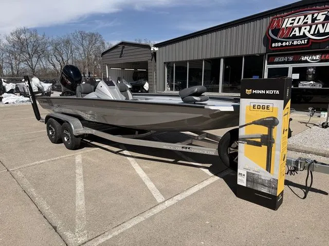 Slide: The Image of 2026 Xpress H20 boat parked outside a marine store. - 8