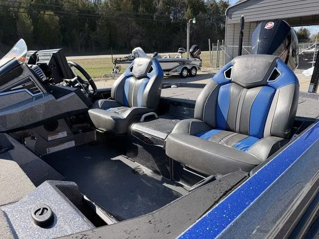 Slide: The Image of Interior of 2024 Ranger Z520R with blue and black seats. - 13
