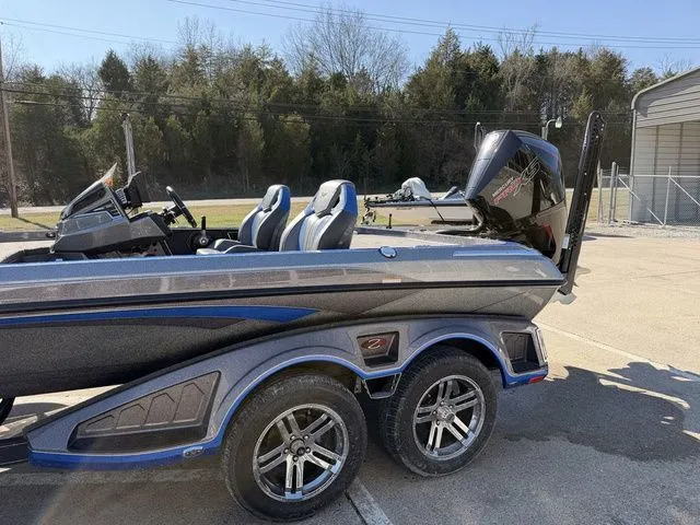 Slide: The Image of 2024 Ranger Z520R boat with dual seats and outboard motor. - 14