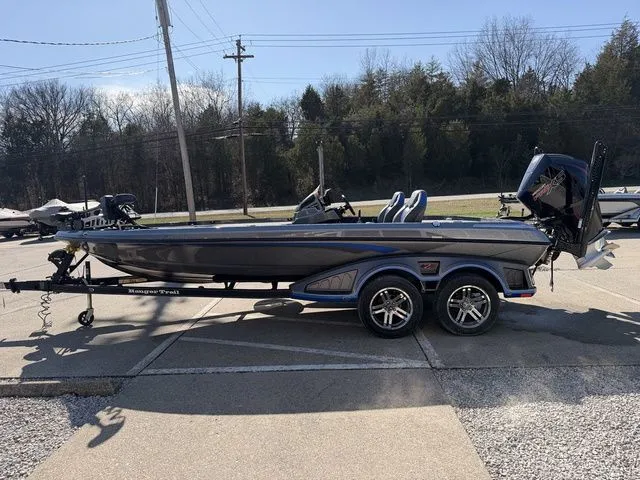 Slide: The Image of 2024 Ranger Z520R boat parked on trailer outdoors. - 16