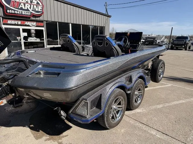 Slide: The Image of 2024 Ranger Z520R boat on trailer outside a marine shop. - 4