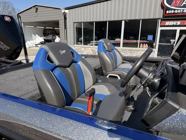 Slide: The Image of 2024 Ranger Z520R boat with blue and gray seats. - 7