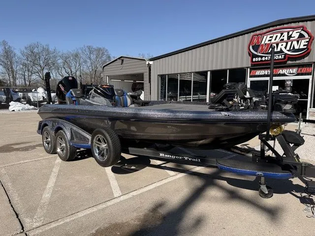 Slide: The Image of 2024 Ranger Z520R boat on trailer outside a marine shop. - 9