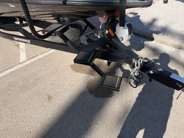 Slide: The Image of Trailer of a 2021 Phoenix 20phx boat in a parking lot. - 12