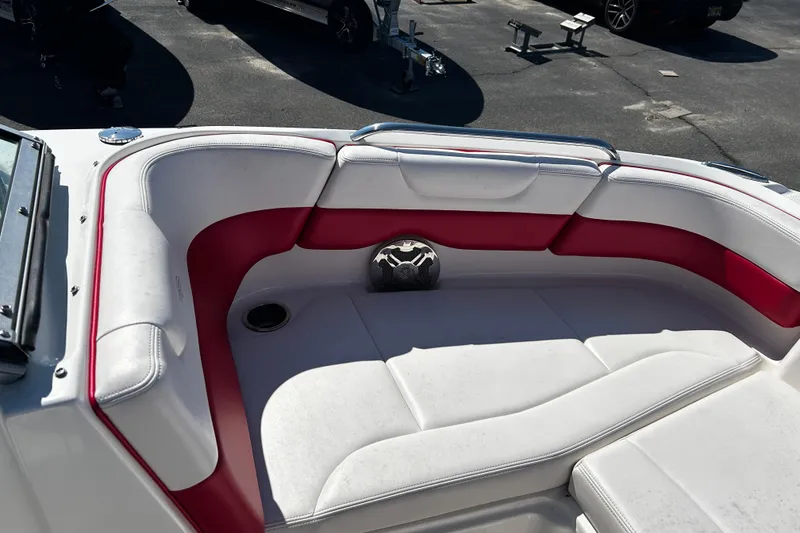 Slide: The Image of 2016 Chaparral 210 Suncoast boat interior with white and red seating. - 11